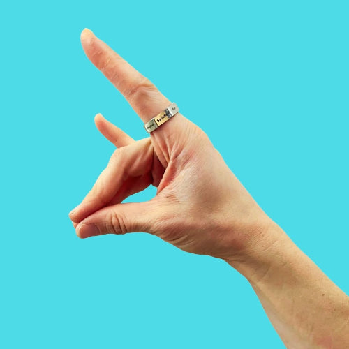 Hunger ring on person's hand making the showing hunger scale states for intuitive eating and mindful eating